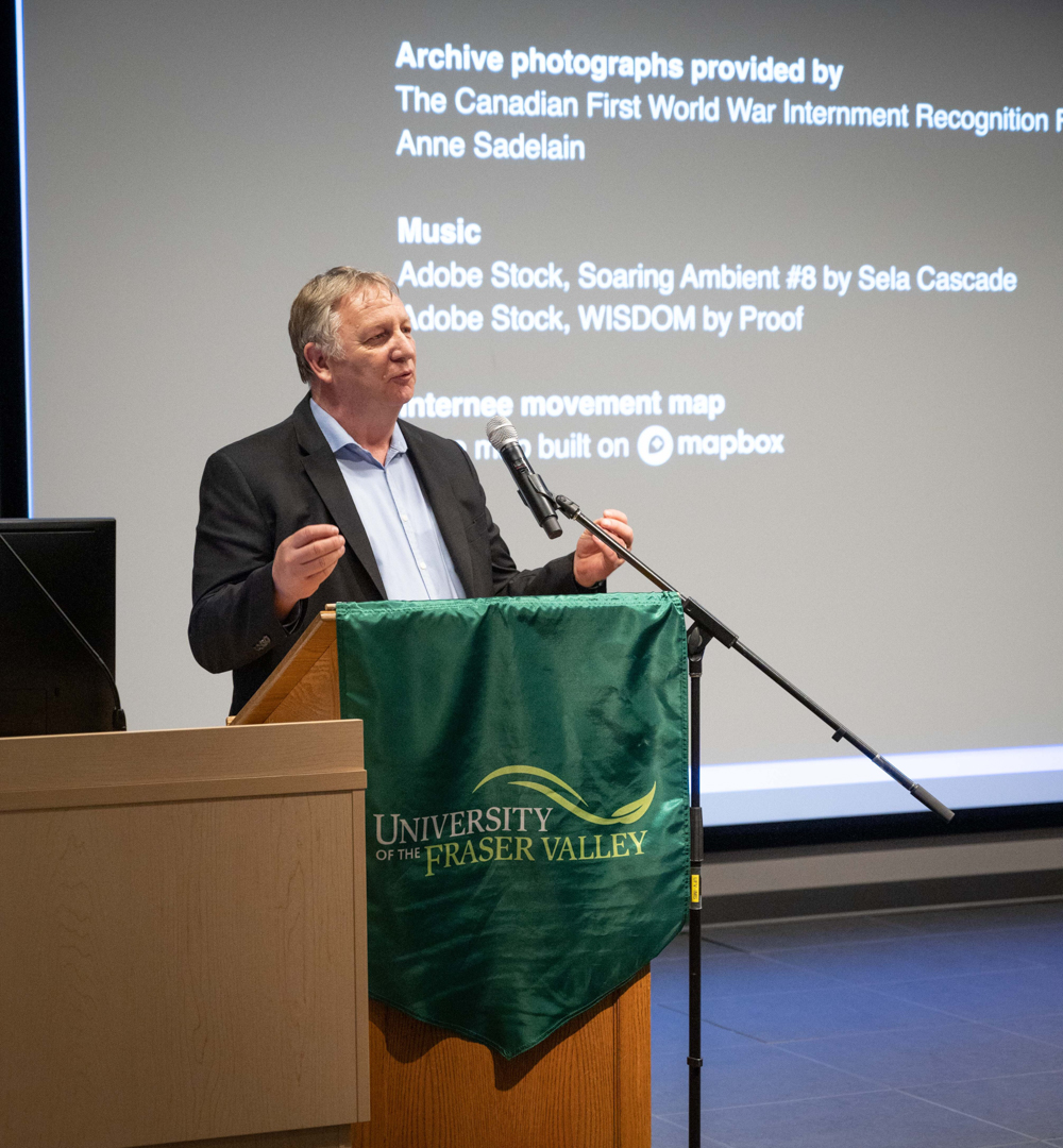 Dr. Garry Fehr speaks from a podium