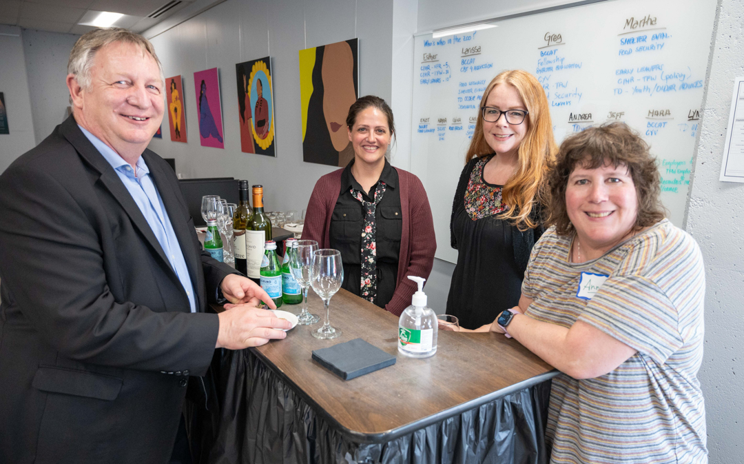 Dr. Garry Fehr, Tracy Morrison, Leona Oakman, and Anne Russell pose for a photo at the bar