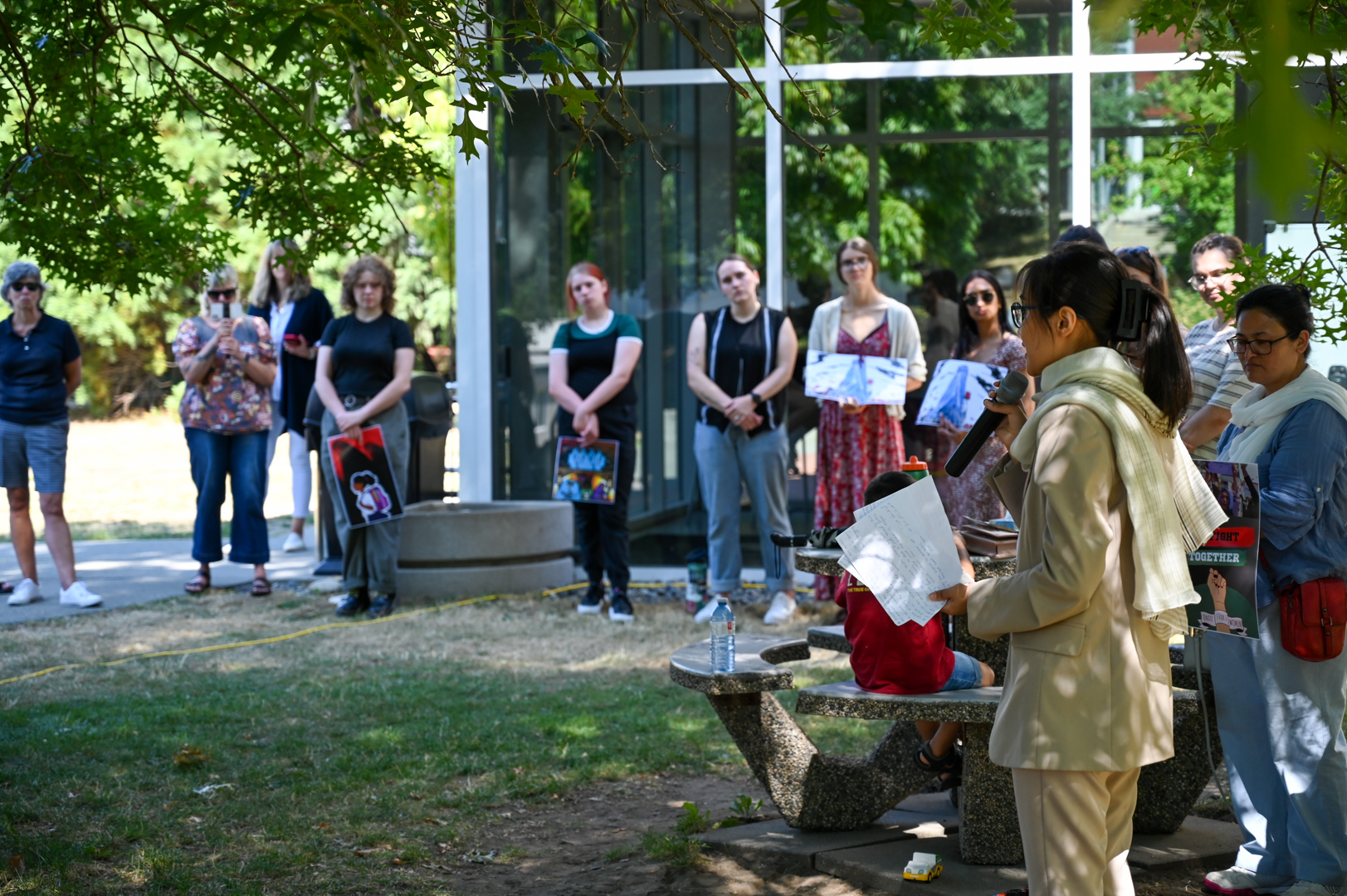 Photo of Sahar Maqsoodi speaking to a crowd outdoors at UFV