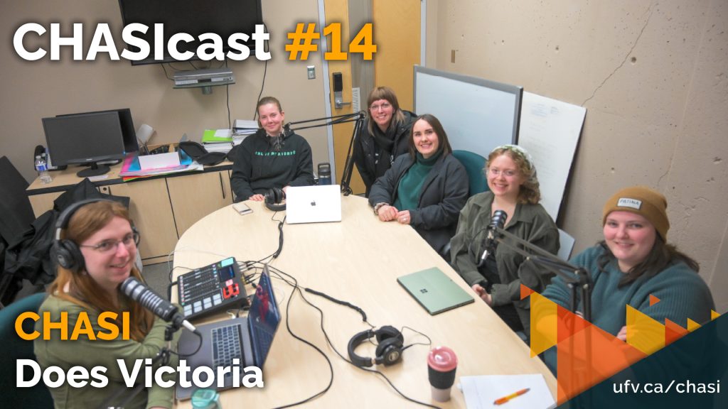Photo of a group of CHASI research and assistants sitting around a table with microphones. Text reads: CHASIcast #14: CHASI Does Victoria.