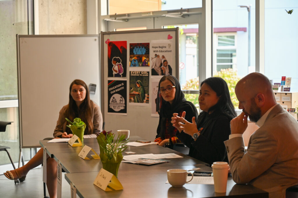 Photo of the panellists from a different angle, with Kimmy Coseteng speaking.