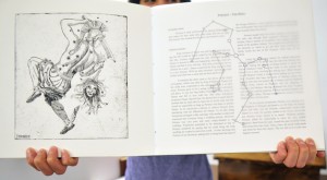 Graduating student Jenessa Galmut and her hand-made book on constellations.