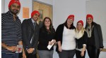 The winning team in the BUS 320 marketing presentations wearing their Abbotsford Heat red toques. They are pictured with Roxann Bury (third from left), senior manager of marketing and sales for the Heat.