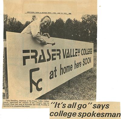 Doug Hamilton with sign announcing Fraser Valley College's arrival.