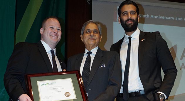Justin P. Goodrich, Chair and Nav Bains, Associate Vice Chair of the UFV Alumni Association present Mr. Upkar Sharma, President of SD College, with lifetime honorary alumni status with the University of the Fraser Valley.