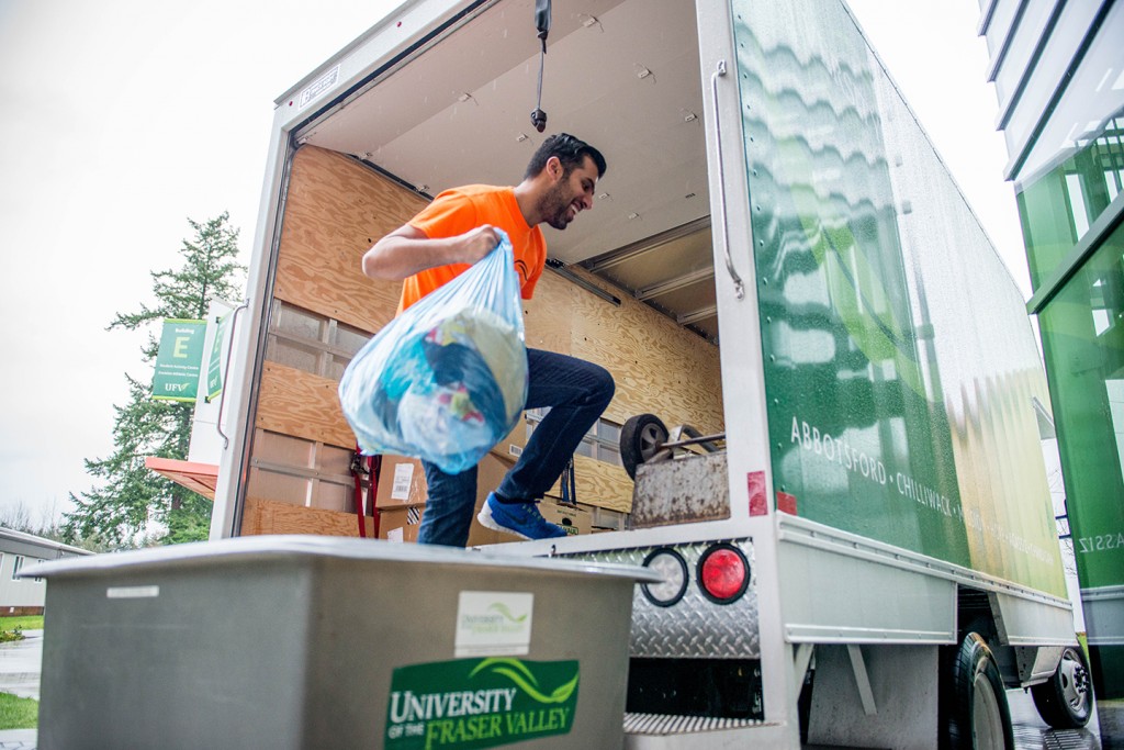 UFV student Aziz Alfadel loads donations destined for Syrian refugees settling in BC