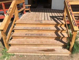 1890 Wounded Knee Remember l7th Generation lettered on stairs