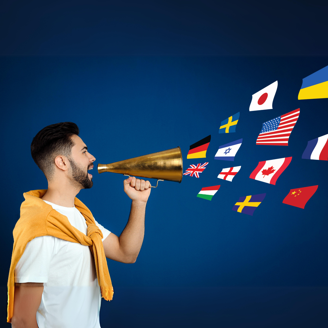 a man holding a golden bullhorn with flags coming out of the bullhorn.