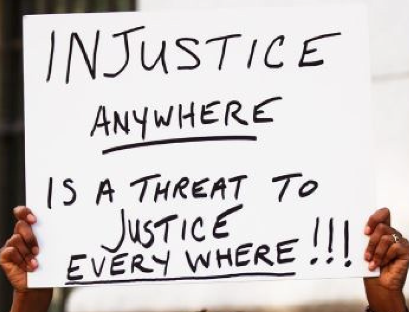 Sign that says "Injustice anywhere is a threat to justice everywhere!"