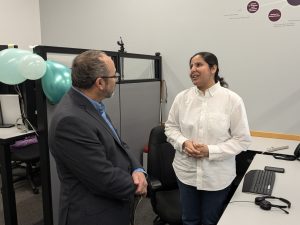 Fizza Haider chatting with faculty