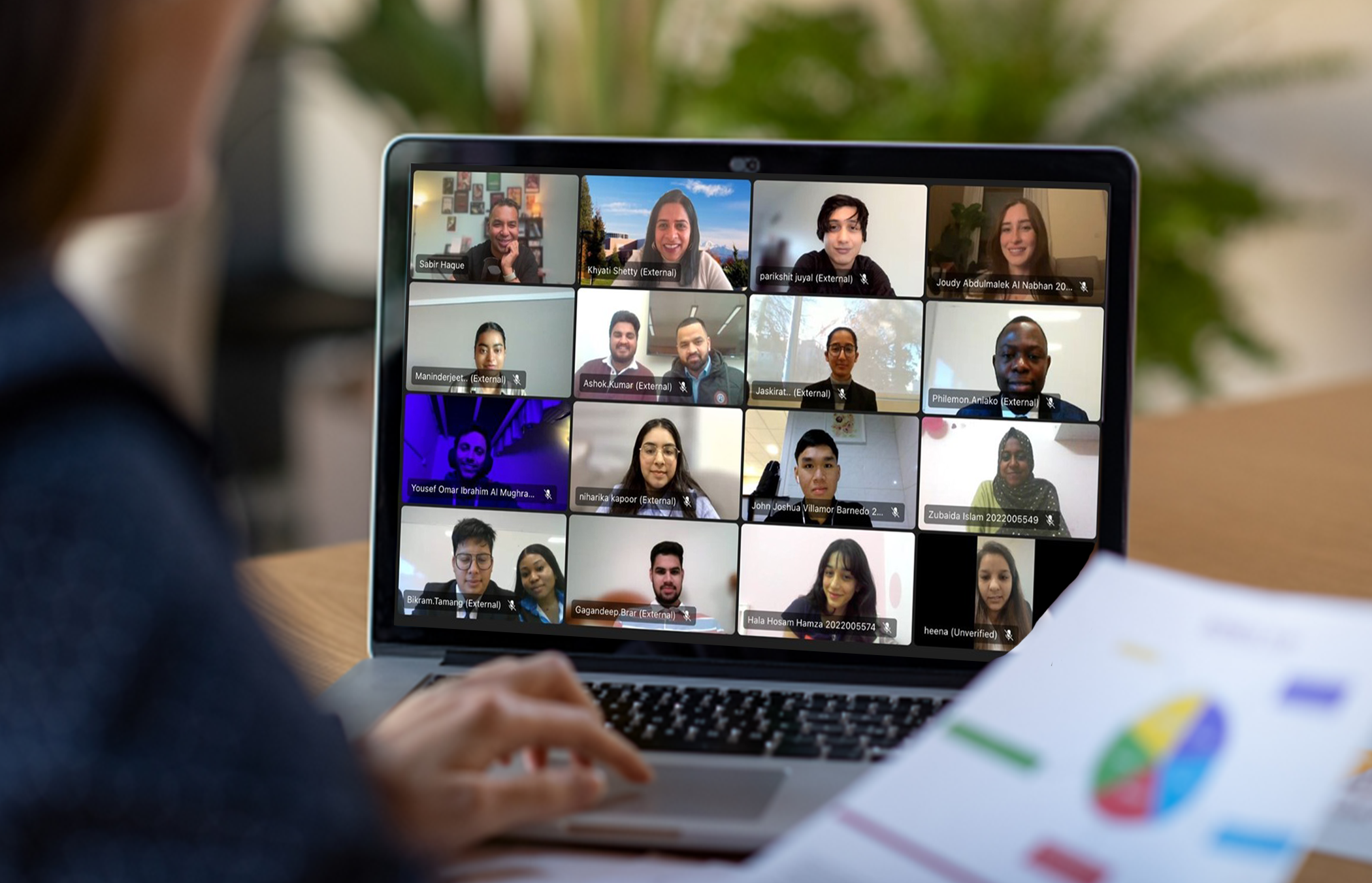 laptop showing multiple people from COIL on a Zoom meeting