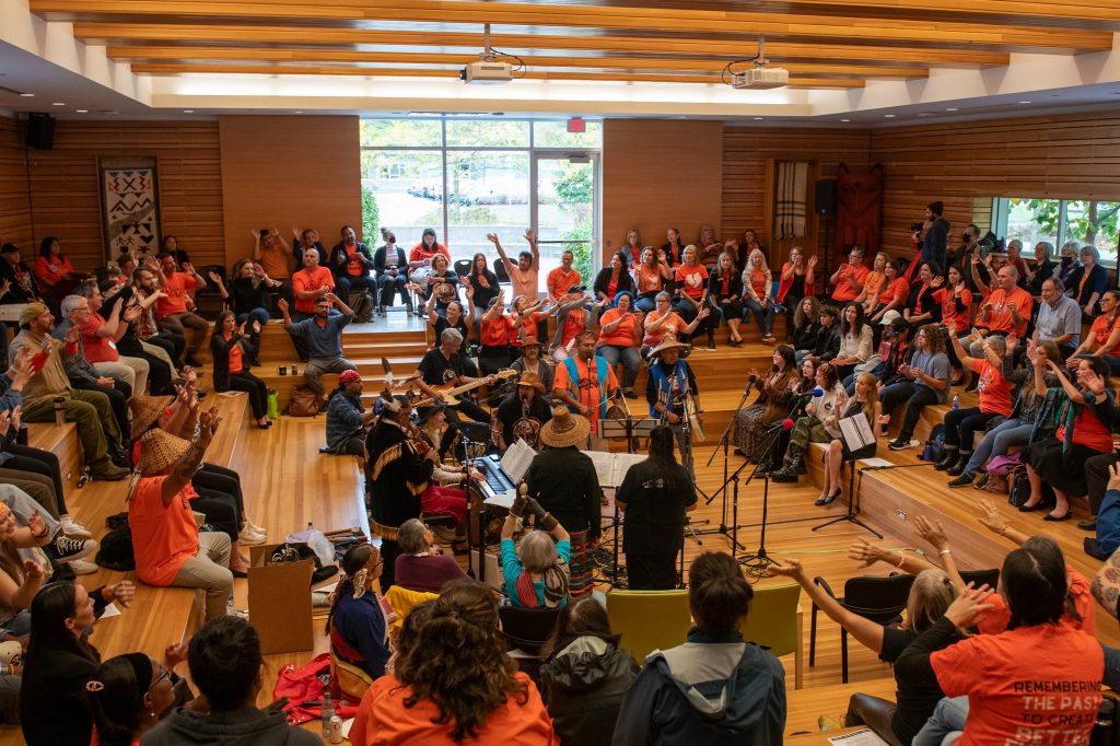 UFV gathering place full of people wearing orange shirts.