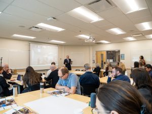 James Mandigo presents to a room of educators at ConnectED 2026, speaking about student transitions from high school to post-secondary education.